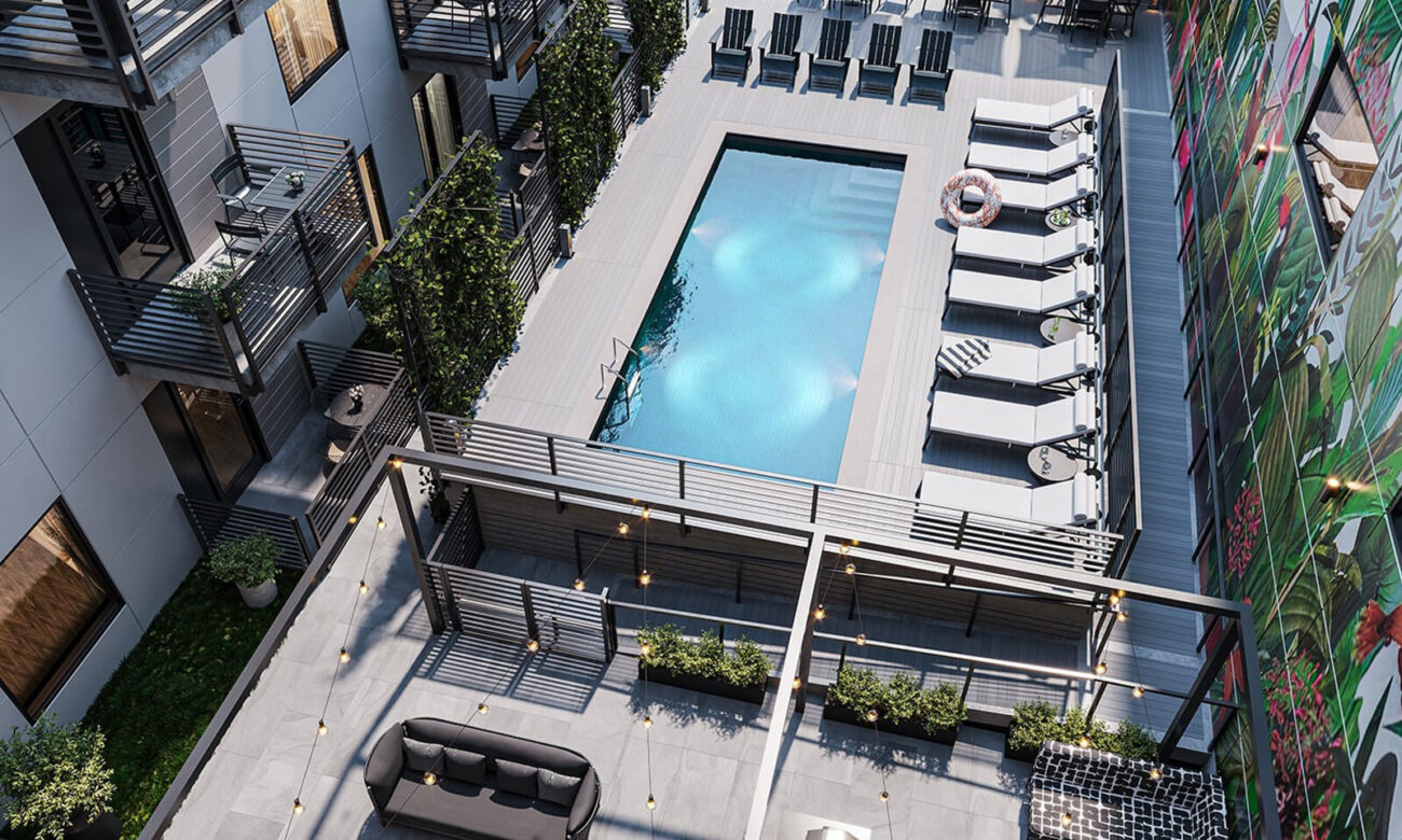 High up view of outdoor pool at VIV and surrounding seating/hanging areas.